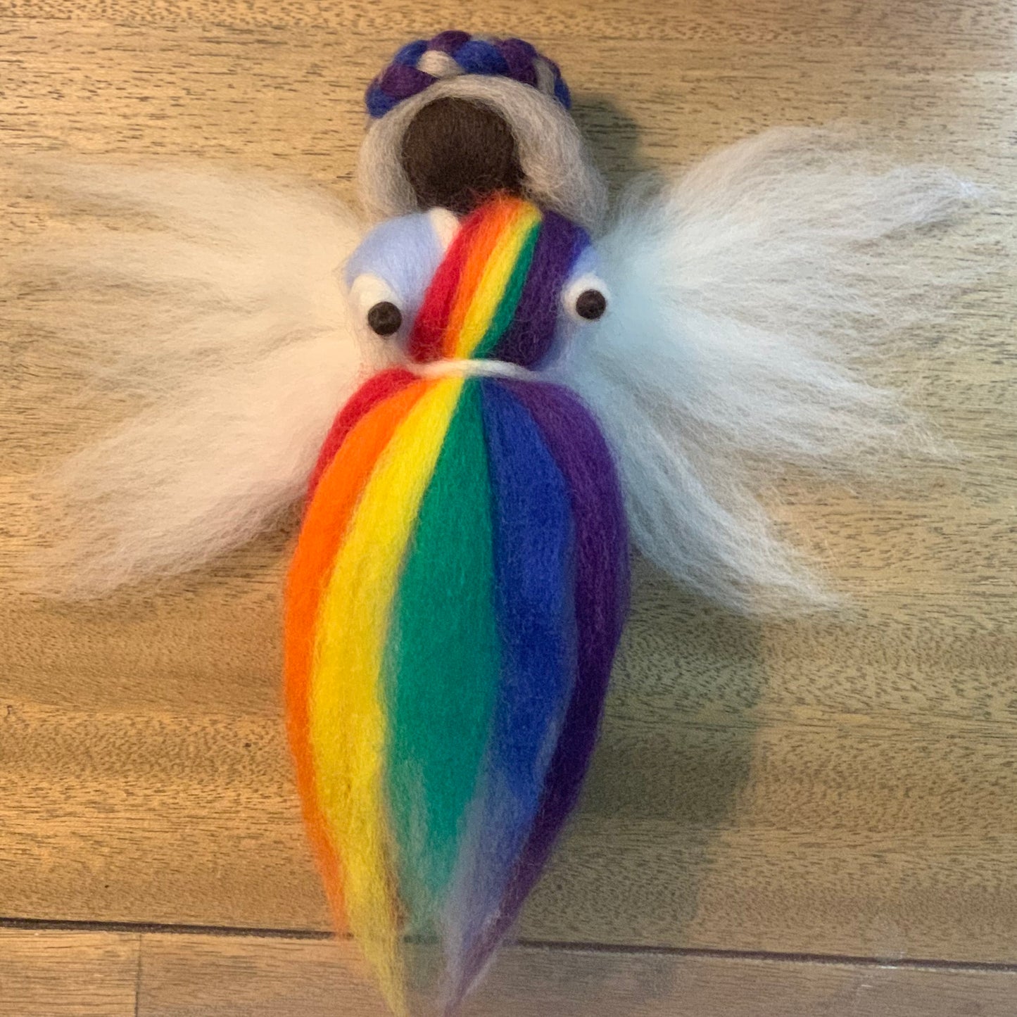 a parrot sitting on top of a bird
