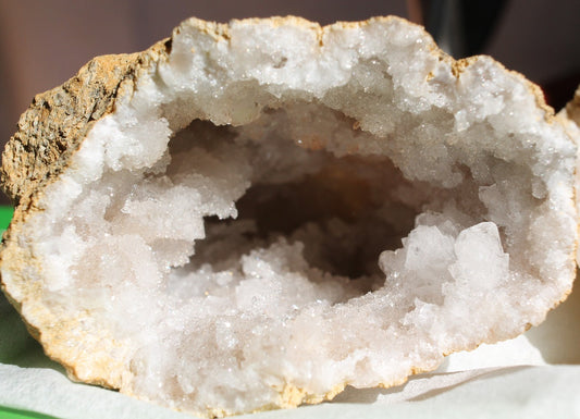 a close up of a doughnut with white frosting 