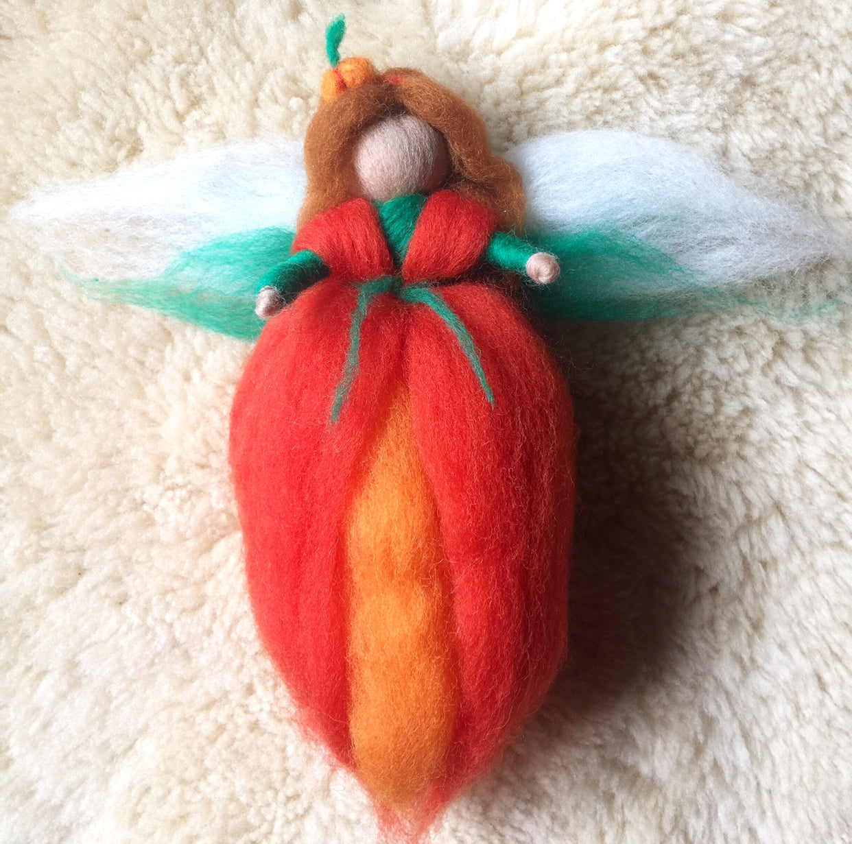 a close up of a red apple on a towel 